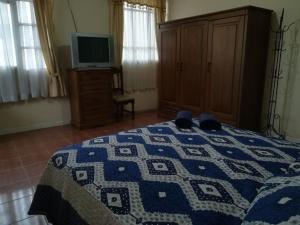 Voodi või voodid majutusasutuse Apartamento Golden toas
