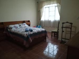 Voodi või voodid majutusasutuse Apartamento Golden toas