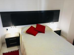 Postel nebo postele na pokoji v ubytování Apartamentos Las Haciendas Altamar + 5 fotografií