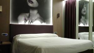 Postel nebo postele na pokoji v ubytování Hotel Camelia