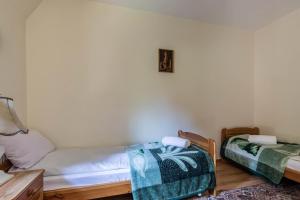 Ένα ή περισσότερα κρεβάτια σε δωμάτιο στο Apartamenty przy Potoku