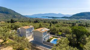 an aerial view of a villa with a pool and trees at Abeli Villas in Nydri