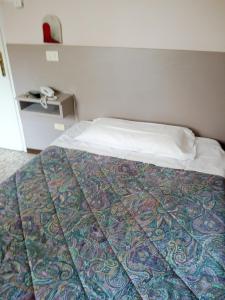 Voodi või voodid majutusasutuse Hotel Lorena toas