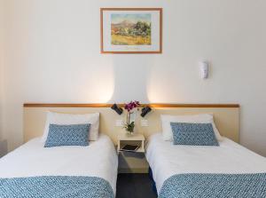 En eller flere senger på et rom på Hôtel Aneto
