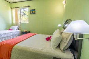 Postel nebo postele na pokoji v ubytování Kayak Lodge
