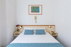 Postel nebo postele na pokoji v ubytování Hôtel Aneto