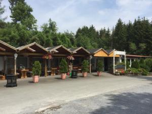 a building with potted plants inront of it at Europa-Feriendorf Husen in Husen