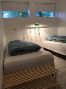 Postel nebo postele na pokoji v ubytování Downtown Selfoss - perfectly located apartment