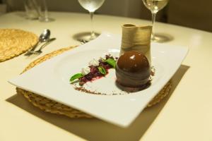 a white plate with a dessert on a table at Nayara Hangaroa in Hanga Roa