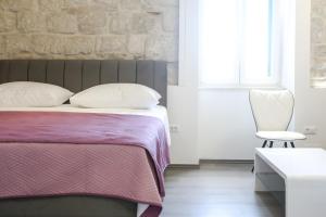Postel nebo postele na pokoji v ubytování Villa Kate