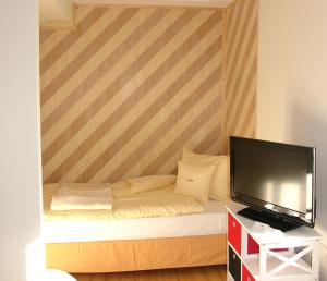Ein Bett oder Betten in einem Zimmer der Unterkunft Villa Andante Apartmenthotel