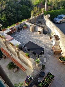 an aerial view of a patio with a table and potted plants at Villa Eugenia in Livorno