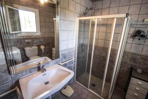 a bathroom with a sink and a shower at Susana - this lovely detached holiday property in Moraira in Moraira +14 photos
