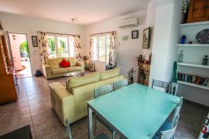 a living room with a couch and a table at Susana - this lovely detached holiday property in Moraira in Moraira