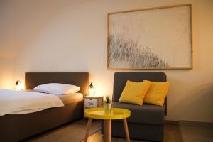 Posteľ alebo postele v izbe v ubytovaní Apartmani Mursa