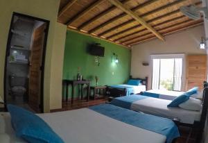 Postel nebo postele na pokoji v ubytování Finca Hotel La Quinta Porra