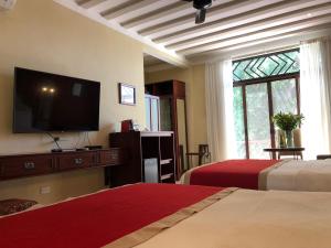 En eller flere senge i et værelse på Casa Italia Luxury Guest House - Adults Only