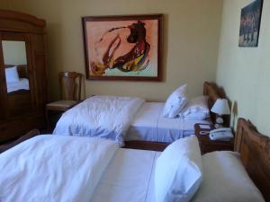 Krevet ili kreveti u jedinici u okviru objekta Hotel Manoir Atkinson