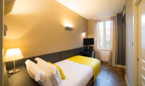 Voodi või voodid majutusasutuse HANNONG Hotel & Wine Bar toas