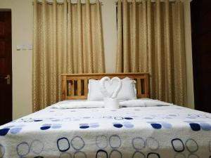 Postel nebo postele na pokoji v ubytování Lourdes Inn