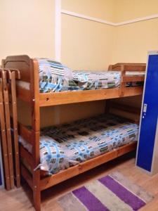 Cama ou camas em um quarto em Hostal Arenas del Mar