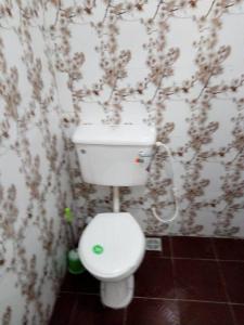 a bathroom with a white toilet in a room at Solar and Inverter Full Service 3 Bedroom Flats in Ikeja