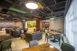 Area soggiorno di Green World Triple Beds