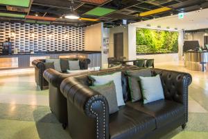 Area soggiorno di Green World Triple Beds