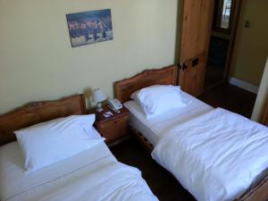 Krevet ili kreveti u jedinici u okviru objekta Hotel Manoir Atkinson