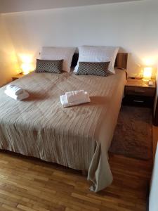 Postel nebo postele na pokoji v ubytování Villa Nino
