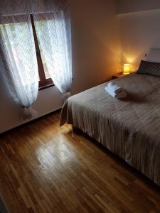 Postel nebo postele na pokoji v ubytování Villa Nino