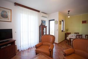 TV a/nebo společenská místnost v ubytování Apartment Pia