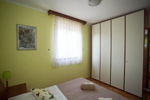 Postel nebo postele na pokoji v ubytování Apartment Pia