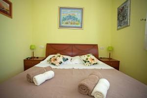Postel nebo postele na pokoji v ubytování Apartment Pia