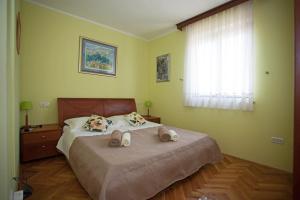 Postel nebo postele na pokoji v ubytování Apartment Pia