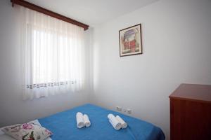 Postel nebo postele na pokoji v ubytování Apartment Pia