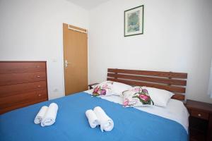 Postel nebo postele na pokoji v ubytování Apartment Pia