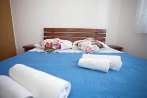 Postel nebo postele na pokoji v ubytování Apartment Pia