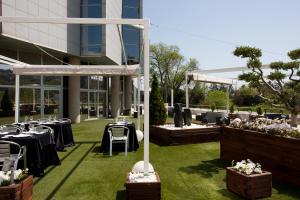 a wedding reception on the lawn of a building at Eurostars Don Cándido in Terrassa