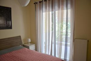 Postel nebo postele na pokoji v ubytování Alex Superior Apartment