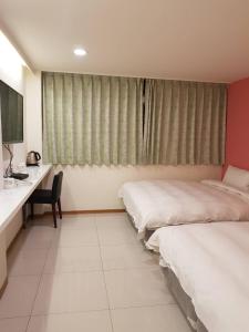 Postel nebo postele na pokoji v ubytování Galaxy Mini Inn + 27 fotografií
