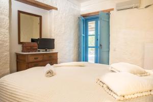 Postel nebo postele na pokoji v ubytování Villa Smaragda