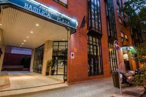 an entrance to a building with a sign for aella fusion at Espahotel Plaza Basílica in Madrid