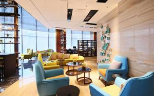 Area soggiorno di Hampton By Hilton Foshan Sanshui