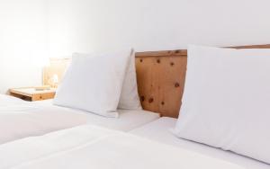 Ein Bett oder Betten in einem Zimmer der Unterkunft Hotel Alte Post by Mountain Hotels