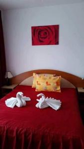 Un pat sau paturi într-o cameră la Vila Queen