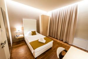 Postel nebo postele na pokoji v ubytování Hotel Terre Dei Salici