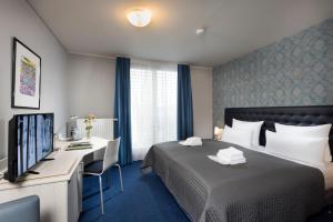 Postel nebo postele na pokoji v ubytování Hotel Ambassador-Berlin Grünau