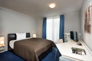 Postel nebo postele na pokoji v ubytování Hotel Ambassador-Berlin Grünau