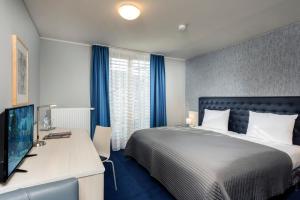 Postel nebo postele na pokoji v ubytování Hotel Ambassador-Berlin Grünau